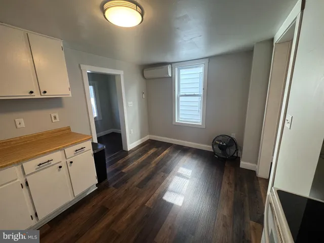 a kitchen with sink and cabinets