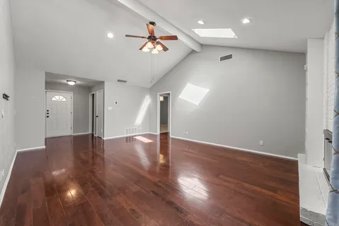 a view of a livingroom with wooden floor