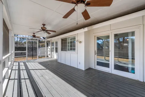 a view of porch with wooden floor