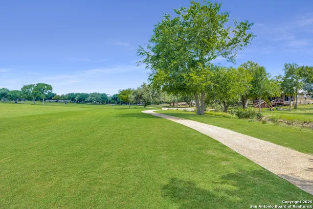 a view of a golf course with a lake