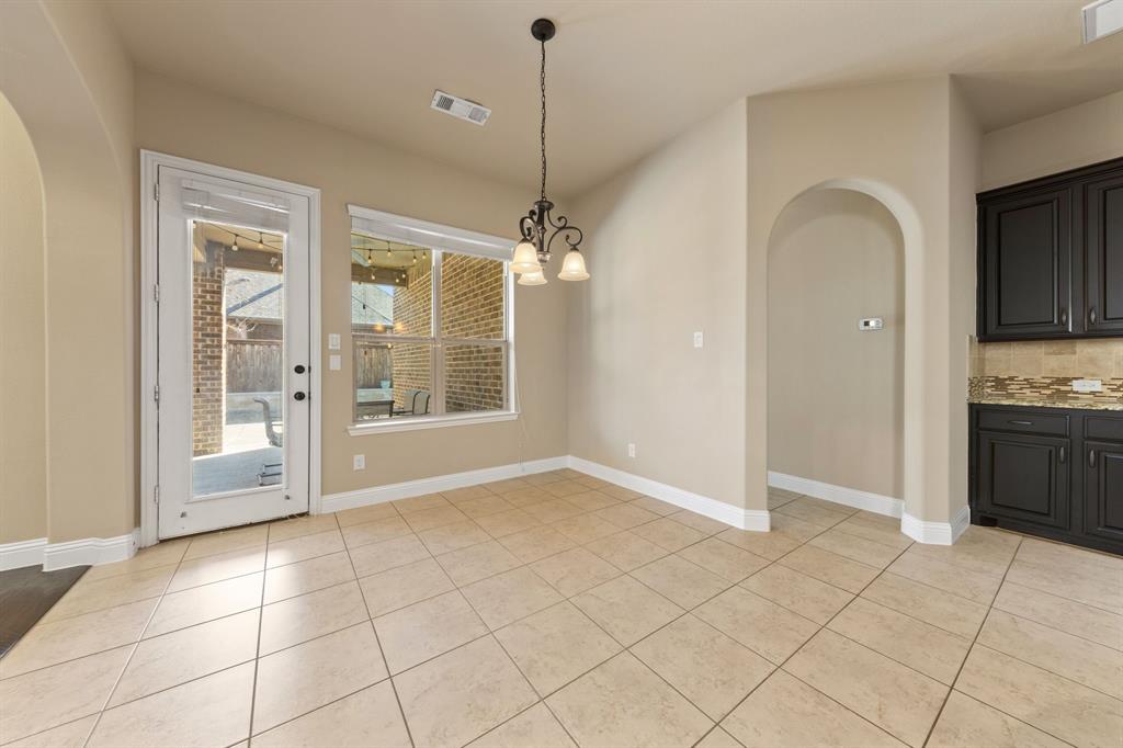 8336 Pitkin Road Frisco, TX 75036 - Photo 14 of 40 a view of a kitchen with windows