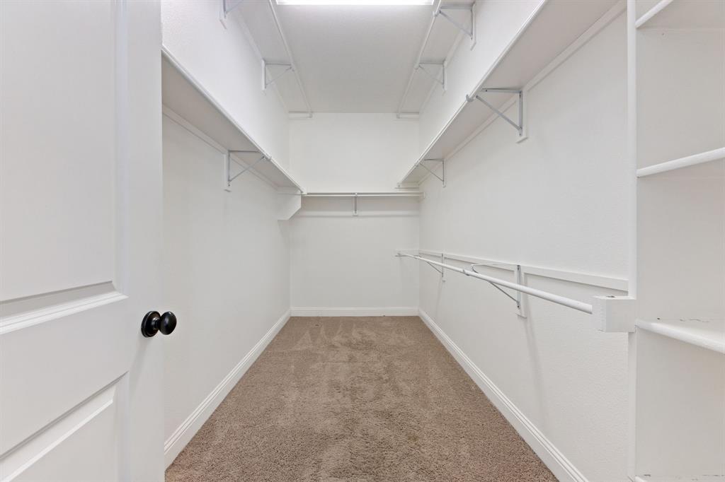 8336 Pitkin Road Frisco, TX 75036 - Photo 28 of 40 a view of a hallway with white walls