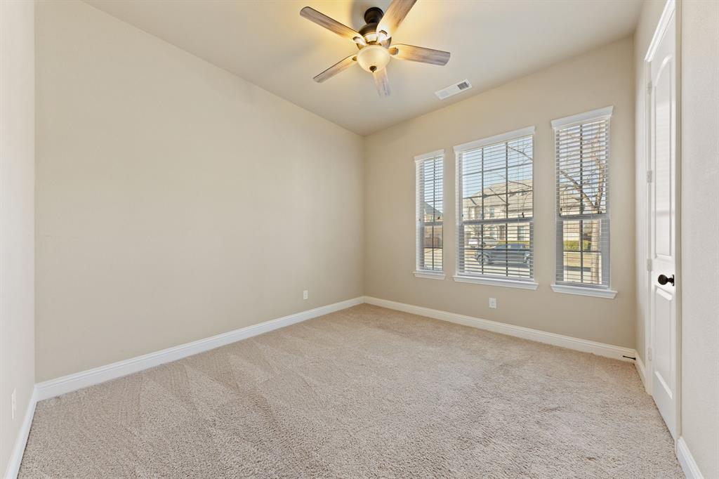 8336 Pitkin Road Frisco, TX 75036 - Photo 29 of 40 an empty room with windows and ceiling fan