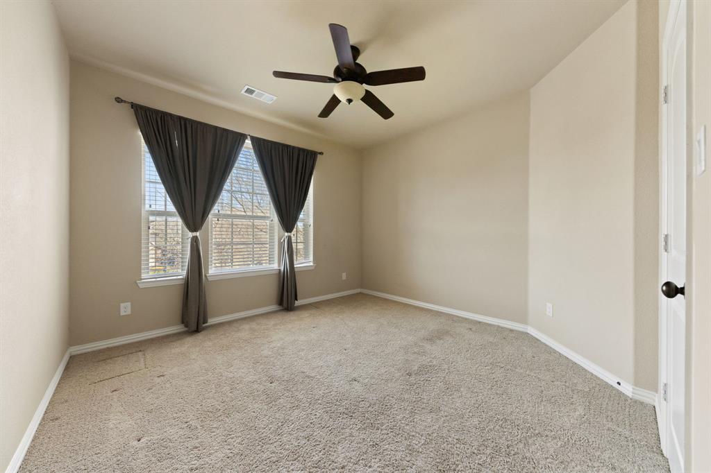 8336 Pitkin Road Frisco, TX 75036 - Photo 31 of 40 an empty room with windows and white walls