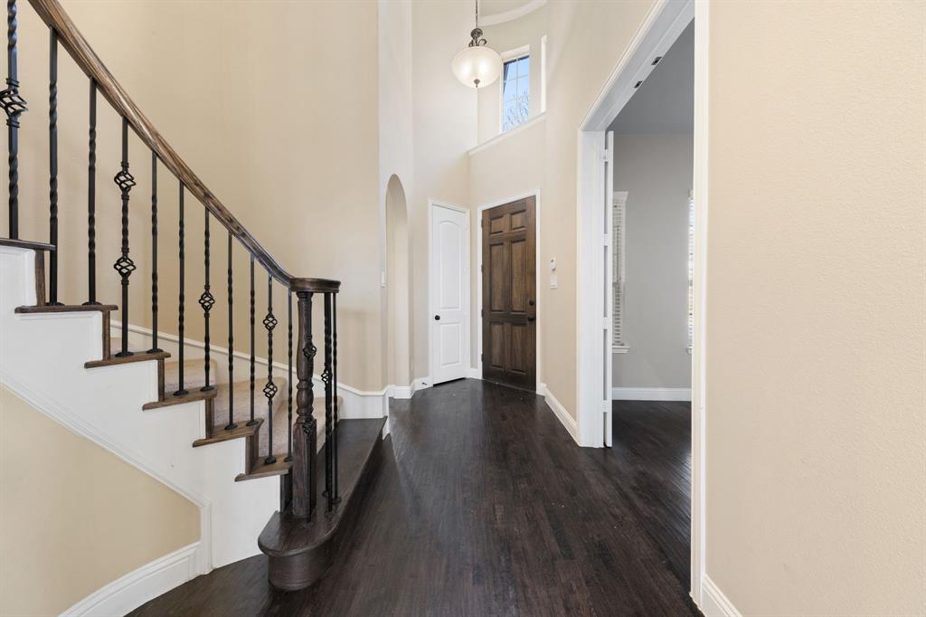 8336 Pitkin Road Frisco, TX 75036 - Photo 4 of 40 a view of an entryway with wooden floor