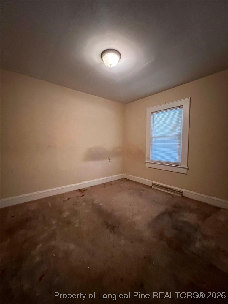 10199 Aberdeen Road Aberdeen, NC 28315 - Photo 14 of 44 an empty room with a empty space and window