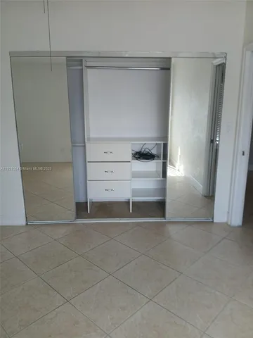 a view of a refrigerator and window