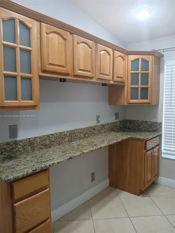 a kitchen with sink and refrigerator