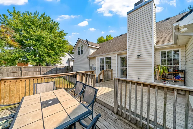 a view of a chair and tables on the roof deck