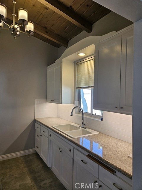 3315 Strongs Drive, Unit B Venice, CA 90292 - Photo 4 of 15 a bathroom with a granite countertop sink and a mirror