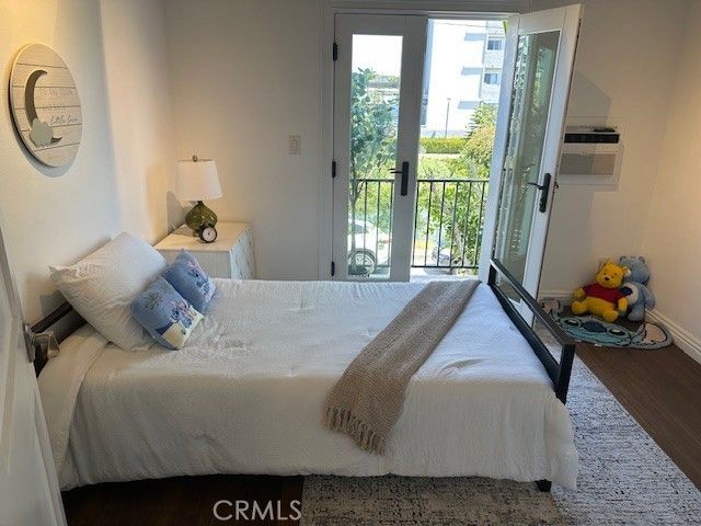 a bedroom with a bed and dresser