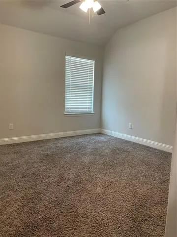 a view of a room that has a window in it