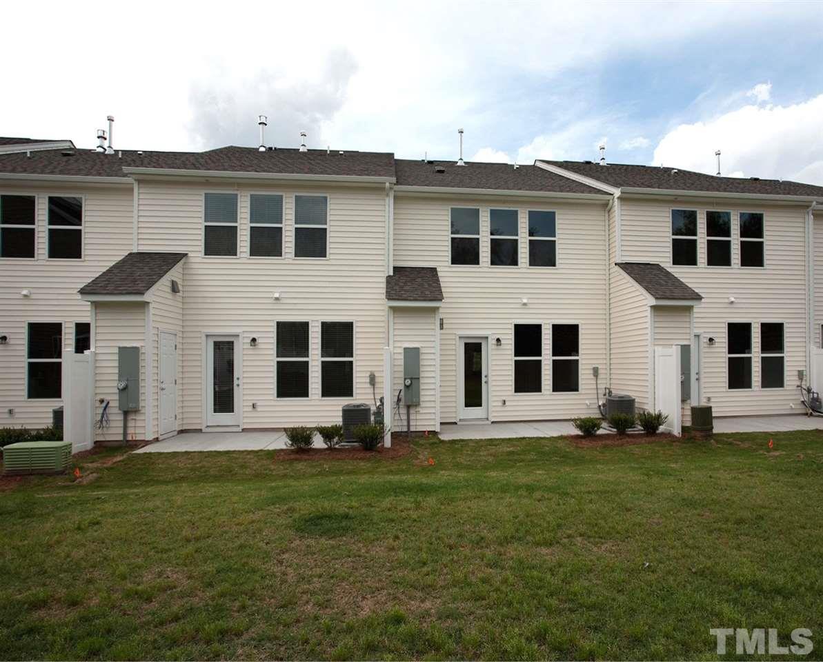 213 Irving Way, Unit 69 Durham, NC 27703 - Photo 25 of 25 a large white house with a yard