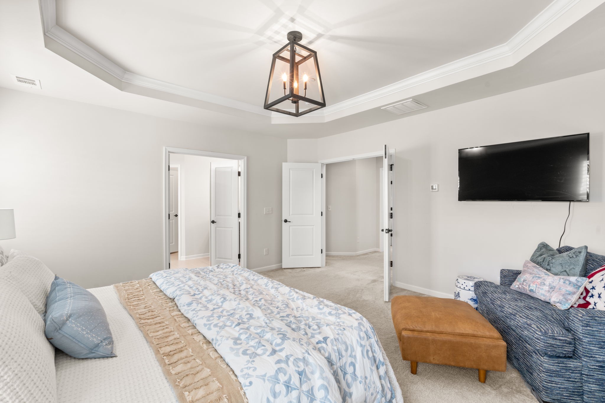 6050 Huntmere Avenue Franklin, TN 37064 - Photo 17 of 38 a bedroom with a bed and a flat screen tv