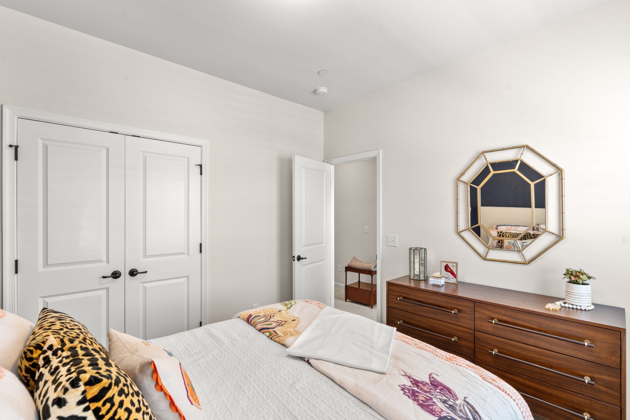 6050 Huntmere Avenue Franklin, TN 37064 - Photo 21 of 38 a bedroom with a bed and a mirror on the dresser