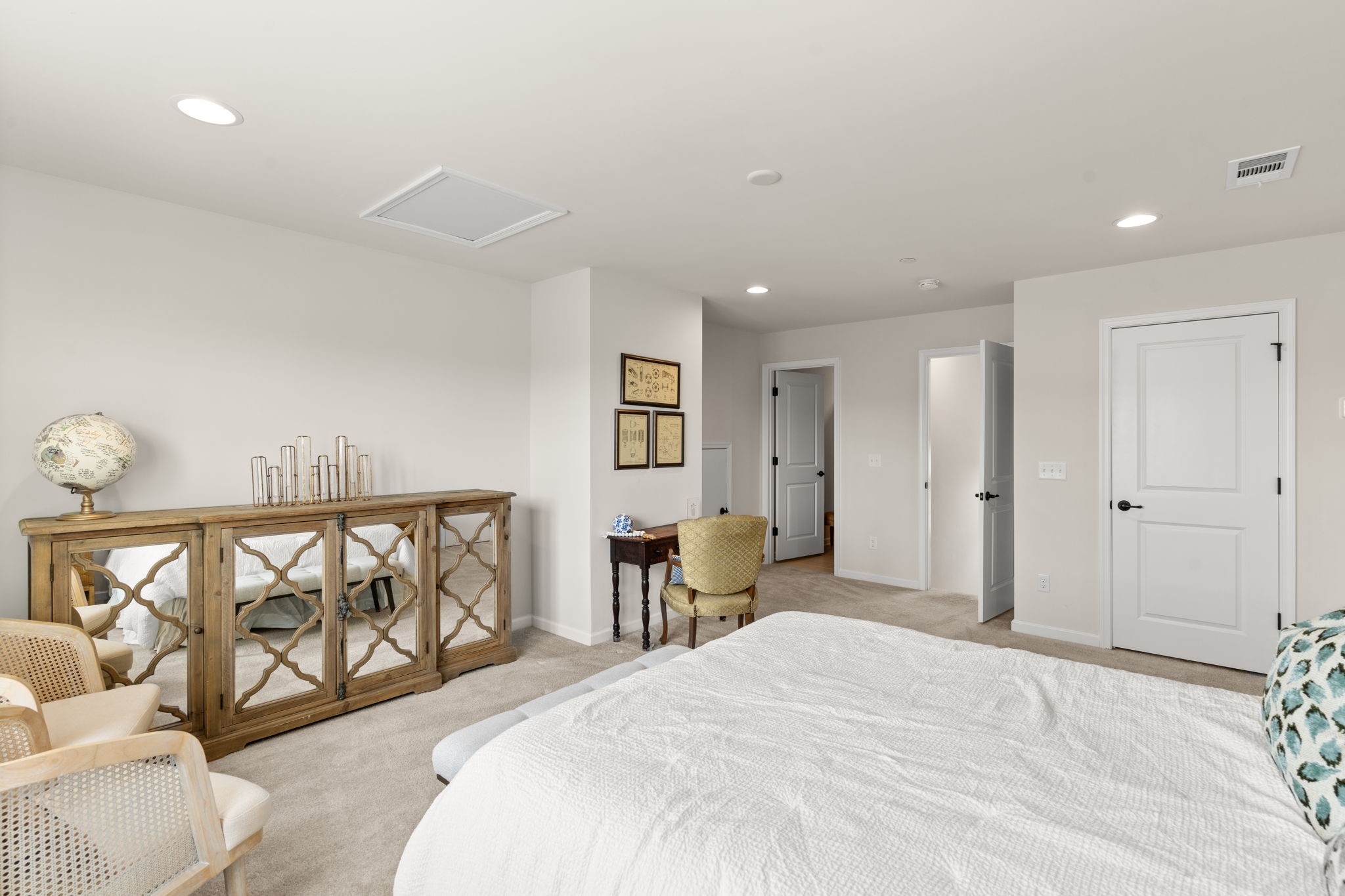 6050 Huntmere Avenue Franklin, TN 37064 - Photo 30 of 38 a spacious bedroom with a bed and painting on the wall