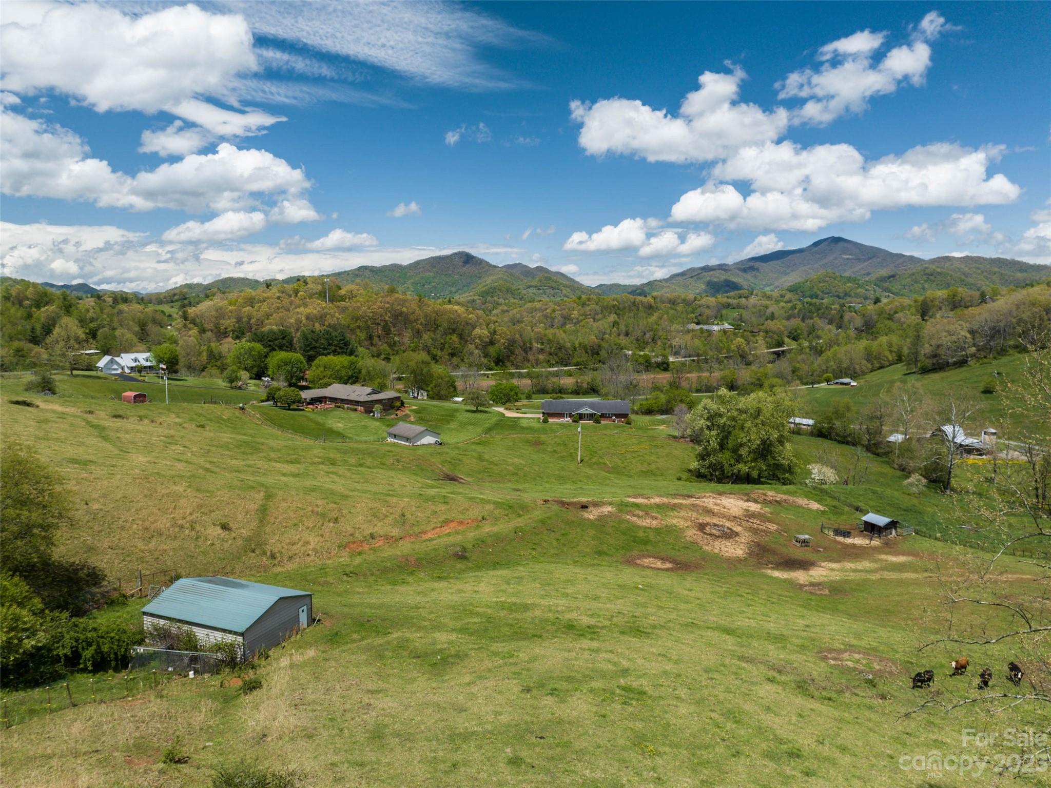 4 Sunny Hill Lane Clyde, NC 28721 - Photo 11 of 27 a view of a lake in middle of the town