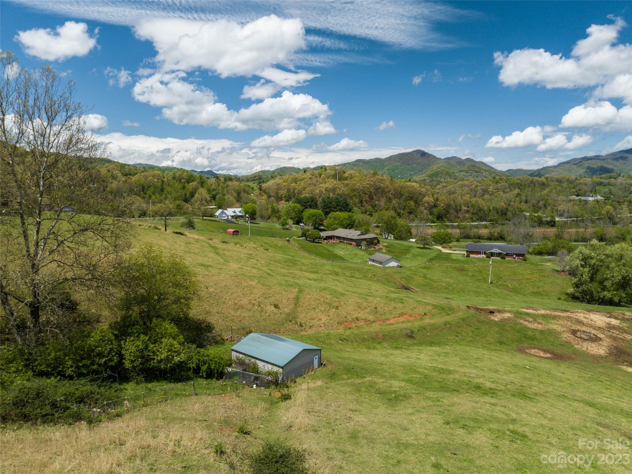 4 Sunny Hill Lane Clyde, NC 28721 - Photo 12 of 27 a view of a lake with a yard