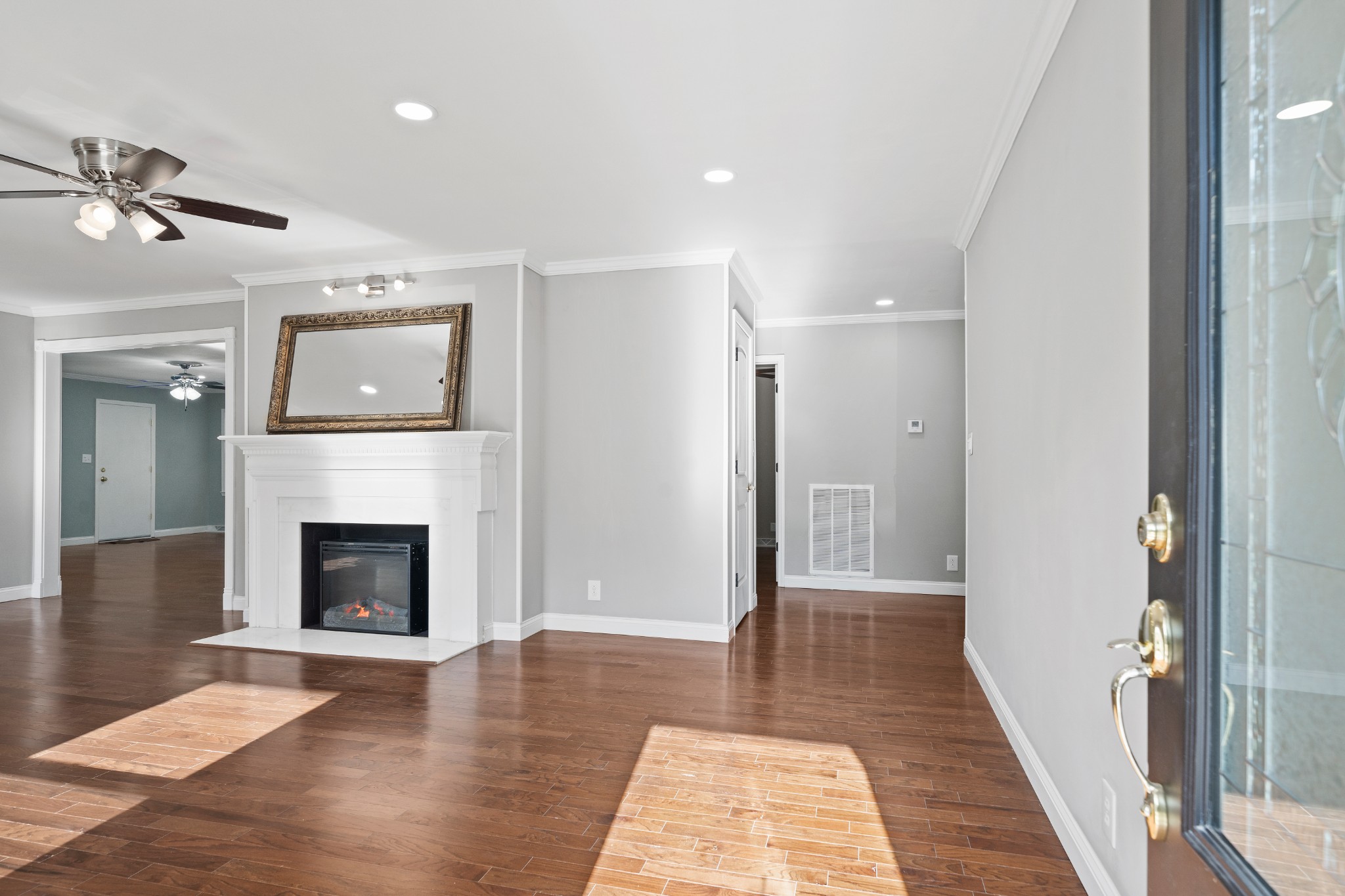964 Gratton Road Clarksville, TN 37043 - Photo 11 of 43 a view of a livingroom with a fireplace wooden floor and windows