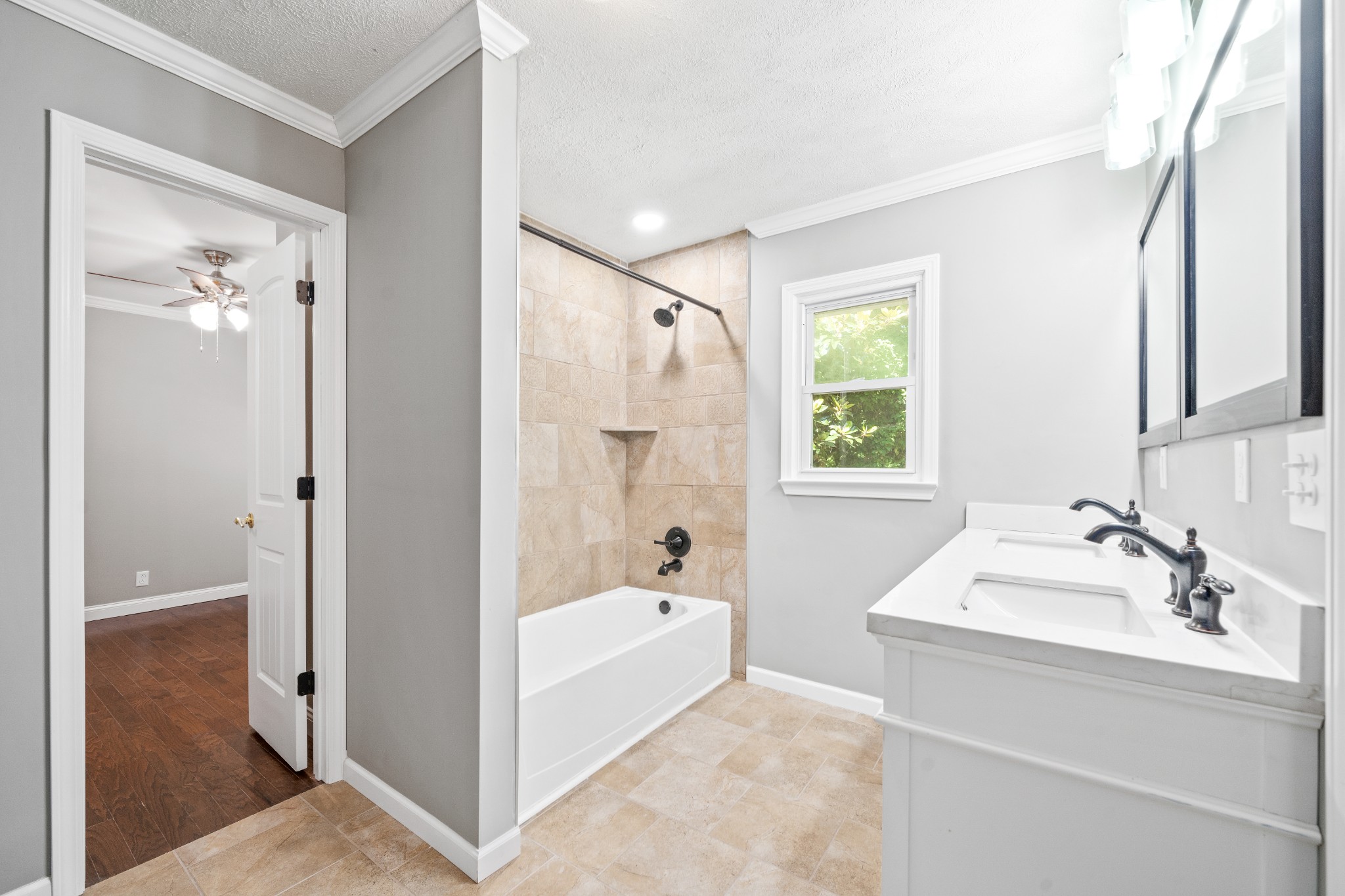 964 Gratton Road Clarksville, TN 37043 - Photo 24 of 43 a bathroom with a tub sink shower and mirror