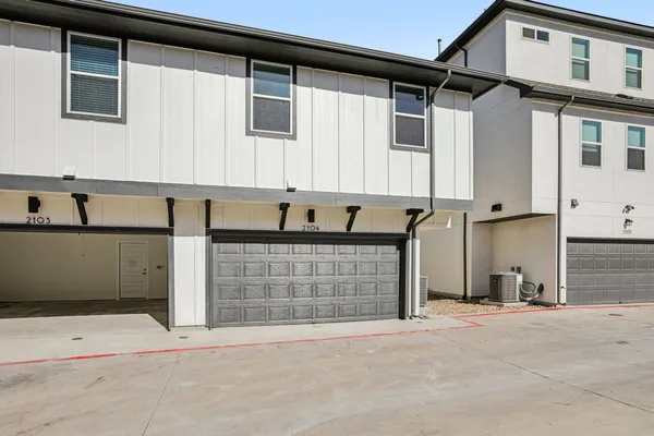 a front view of a house with a garage