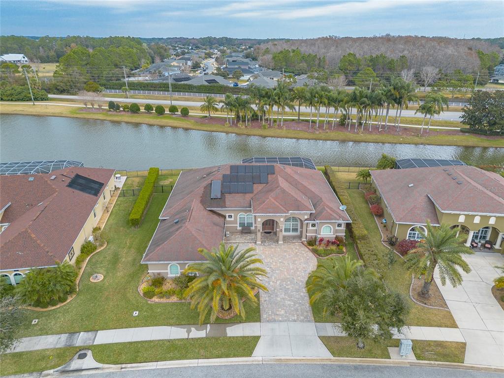 3343 West Locanda Circle New Smyrna Beach, FL 32168 - Photo 11 of 55 an aerial view of residential houses with outdoor space and river