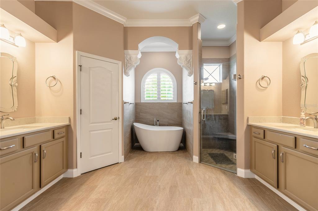 3343 West Locanda Circle New Smyrna Beach, FL 32168 - Photo 19 of 55 a bathroom with a sink toilet and shower