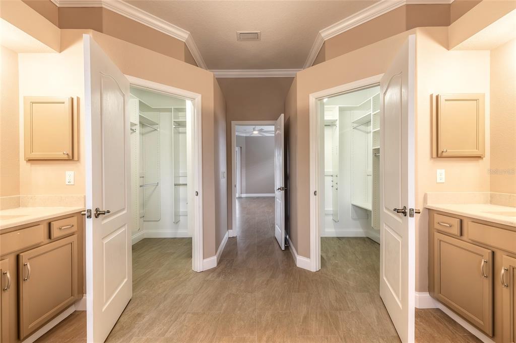 3343 West Locanda Circle New Smyrna Beach, FL 32168 - Photo 22 of 55 a view of a hallway with wooden floor and staircase