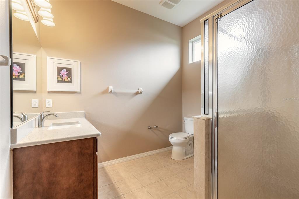 3343 West Locanda Circle New Smyrna Beach, FL 32168 - Photo 26 of 55 a bathroom with a sink toilet and vanity