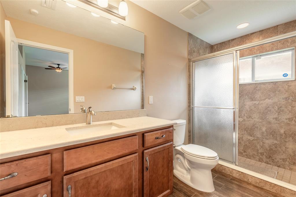 3343 West Locanda Circle New Smyrna Beach, FL 32168 - Photo 31 of 55 a bathroom with a sink a toilet and shower