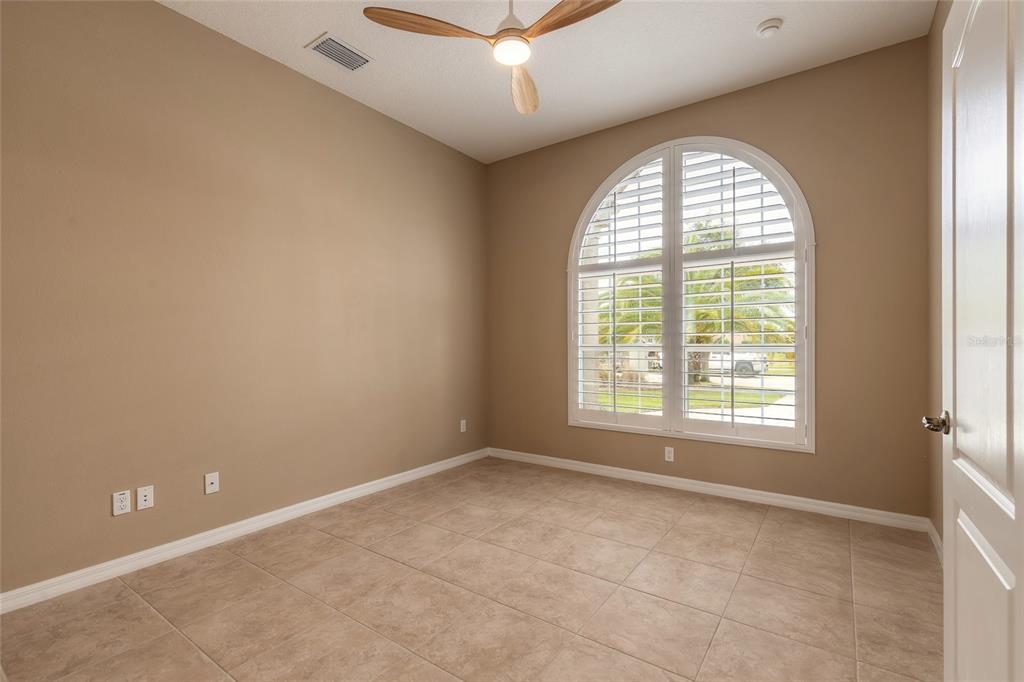 3343 West Locanda Circle New Smyrna Beach, FL 32168 - Photo 32 of 55 an empty room with a window