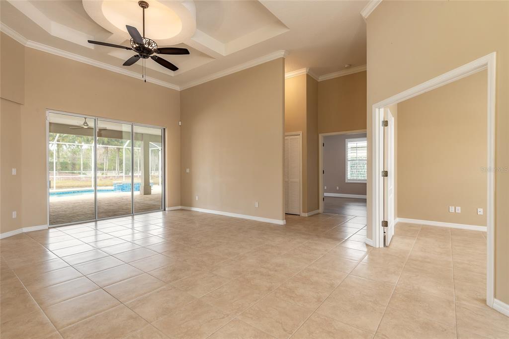 3343 West Locanda Circle New Smyrna Beach, FL 32168 - Photo 36 of 55 a view of livingroom with a ceiling fan and window