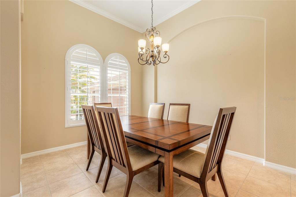 3343 West Locanda Circle New Smyrna Beach, FL 32168 - Photo 40 of 55 a view of a dining room with furniture window and outside view
