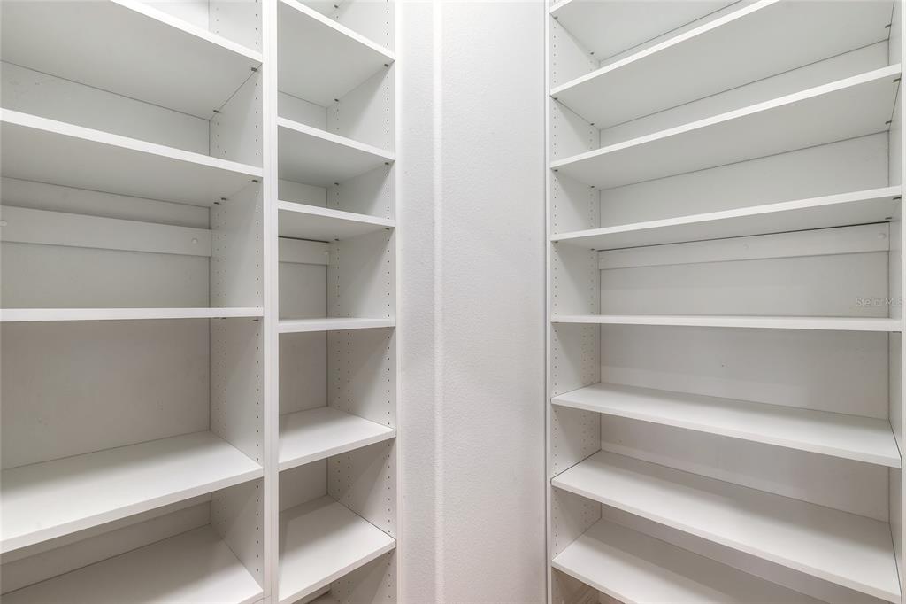 3343 West Locanda Circle New Smyrna Beach, FL 32168 - Photo 42 of 55 a view of walk in closet with empty racks