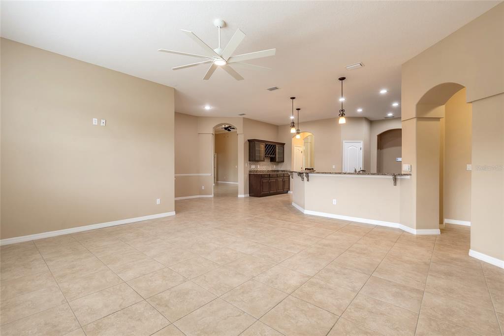 3343 West Locanda Circle New Smyrna Beach, FL 32168 - Photo 44 of 55 a view of a large kitchen with a sink and a refrigerator