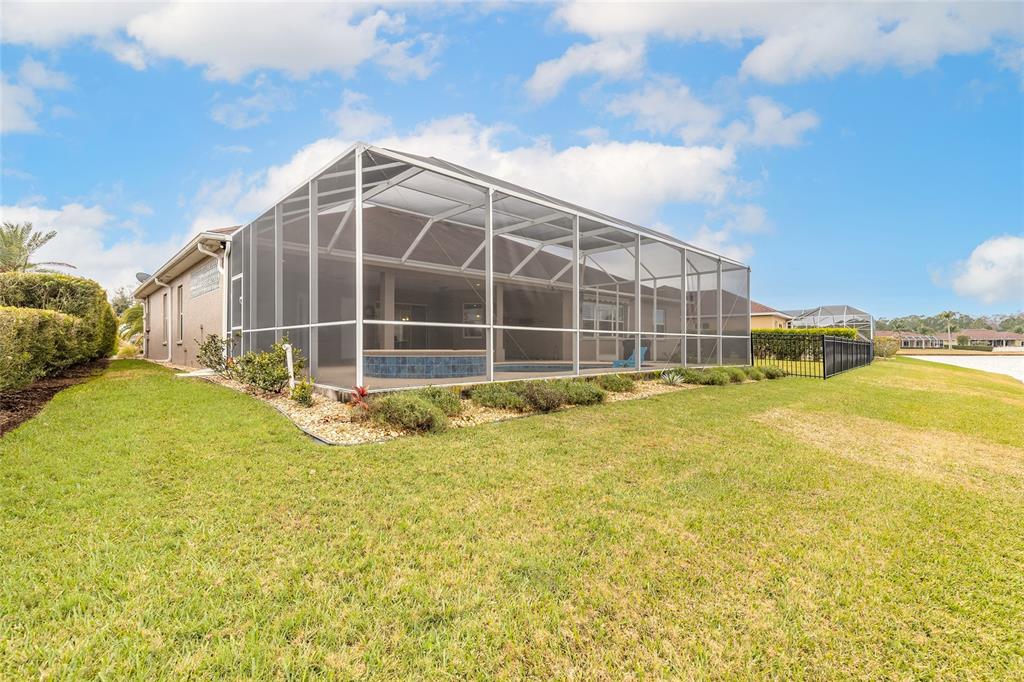 3343 West Locanda Circle New Smyrna Beach, FL 32168 - Photo 55 of 55 a view of a swimming pool with outdoor seating and a pathway