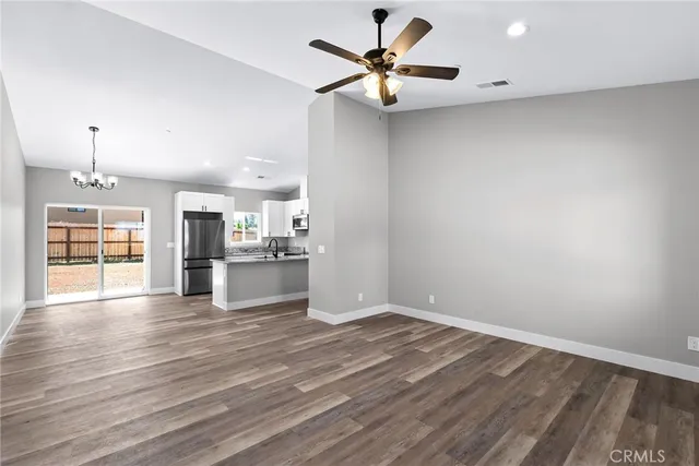 a view of a kitchen with a sink and a window