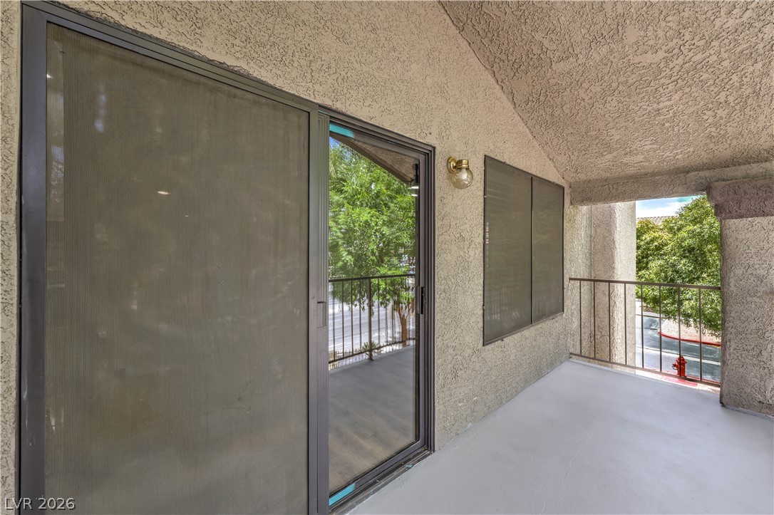 1575 West Warm Springs Road, Unit 322 Henderson, NV 89014 - Photo 21 of 25 Enjoy outdoor living with this inviting balcony, perfect for relaxation and fresh air.
