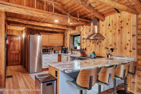 a view of a patio with dining table and chairs