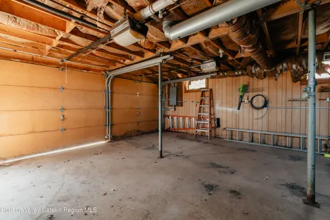 a view of a room with wooden walls