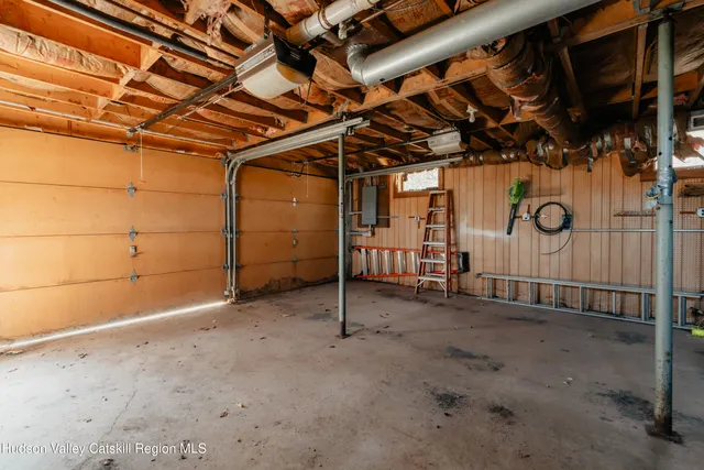a view of a room with wooden walls