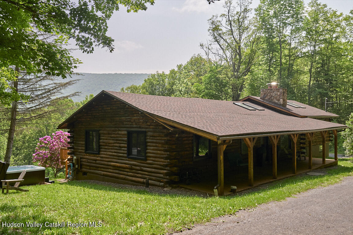 38 Woodchuck Road Roxbury, NY 12421 - Photo 8 of 33 a front view of a house with a garden