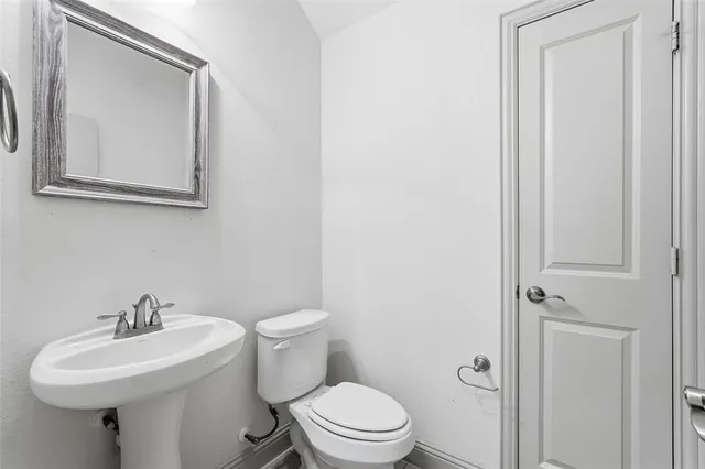 a kitchen with a refrigerator a stove and a sink
