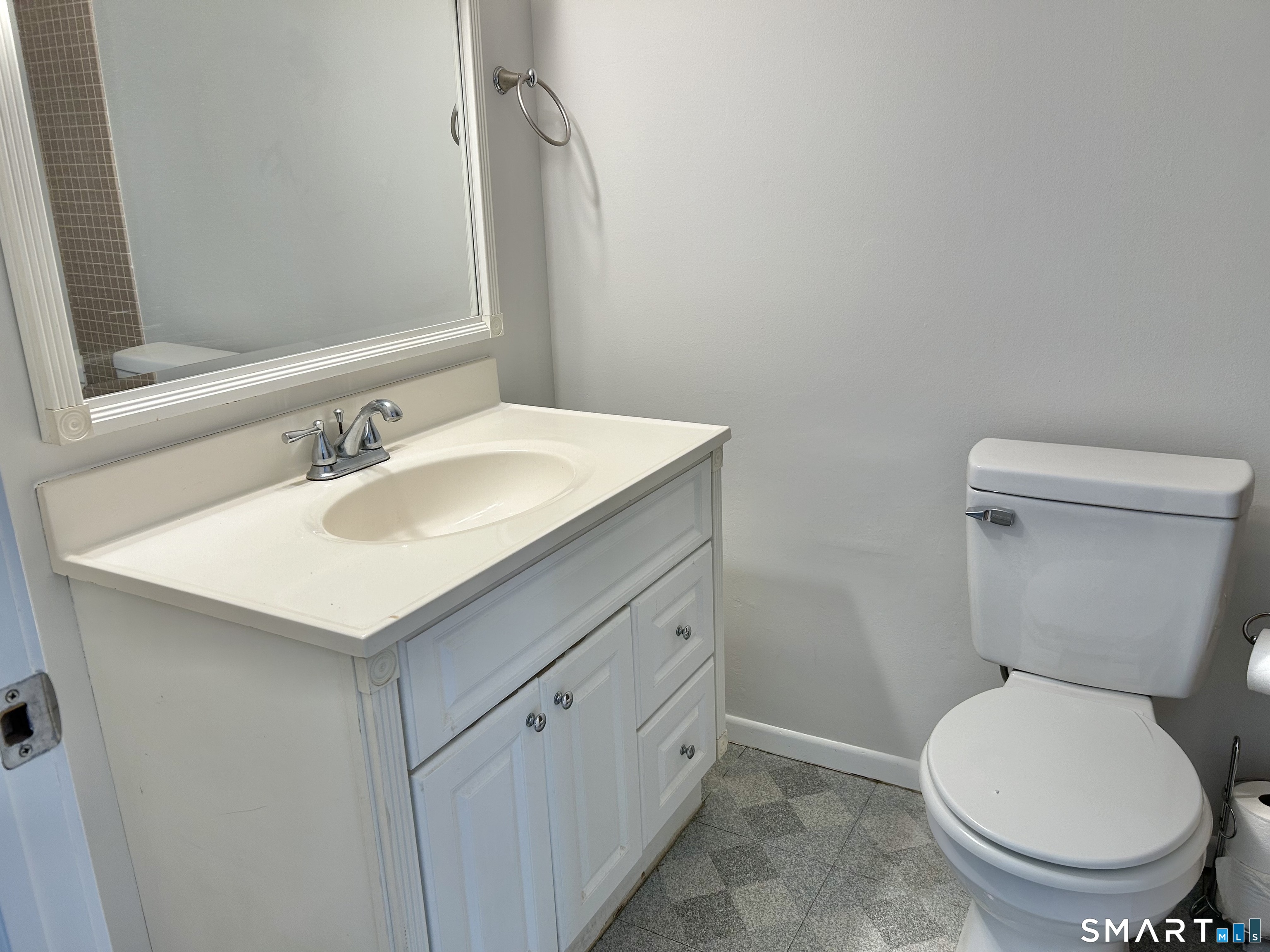 229 Bacon Pond Road, Unit 312 Woodbury, CT 06798 - Photo 13 of 17 a bathroom with a sink toilet and a mirror