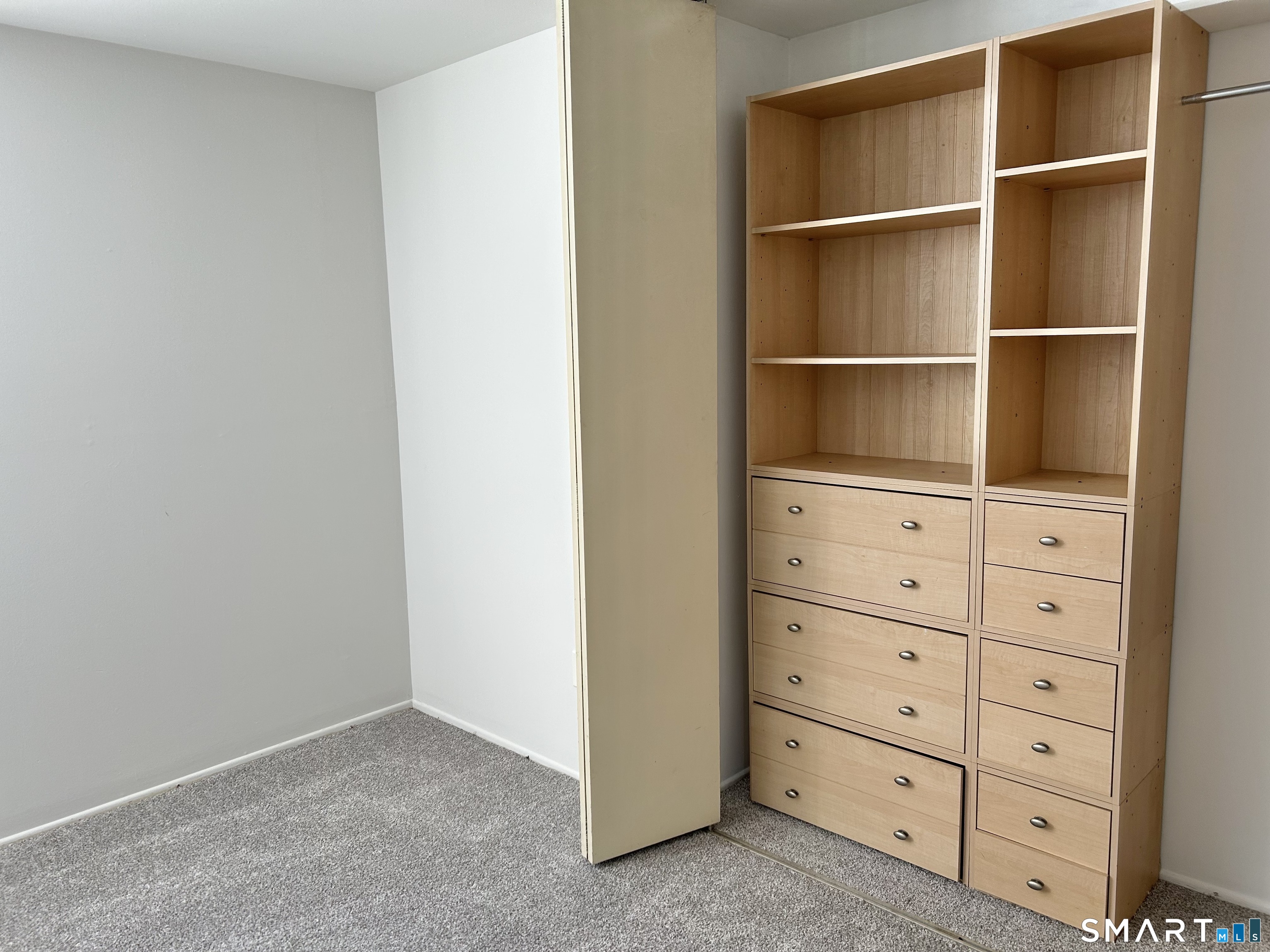 229 Bacon Pond Road, Unit 312 Woodbury, CT 06798 - Photo 17 of 17 a view of an empty walk in closet