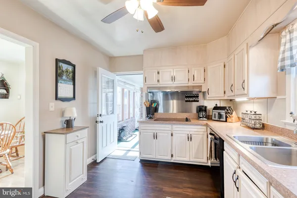 a kitchen with stainless steel appliances granite countertop a sink and cabinets