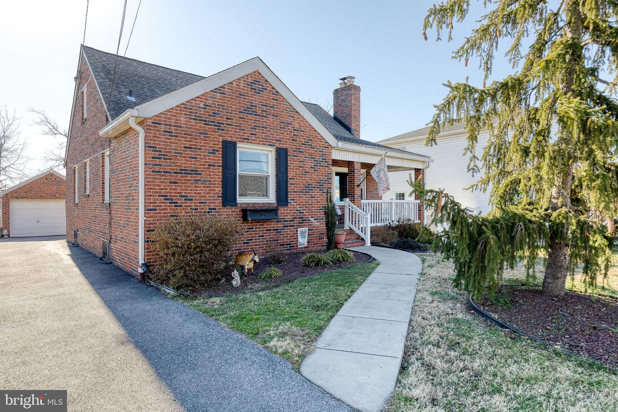 1911 Sunberry Road Dundalk, MD 21222 - Photo 2 of 38 a front view of a house with garden