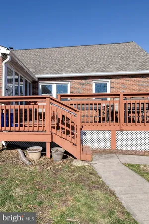 a view of a house with wooden fence