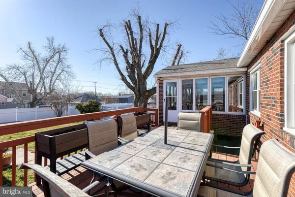 a view of roof deck with seating area