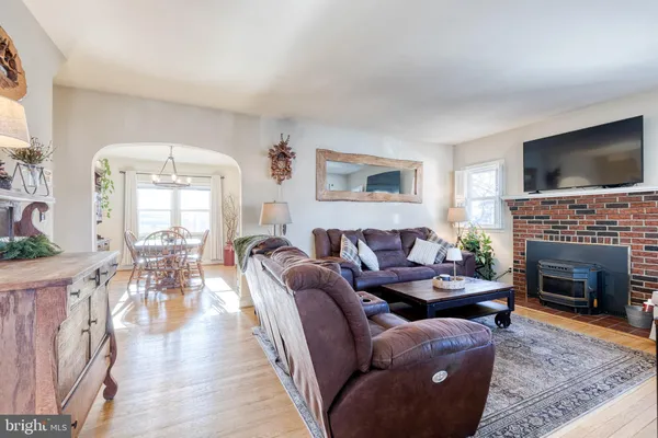 a living room with furniture fireplace and flat screen tv